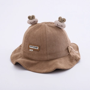 Detailed texture of baby corduroy fisherman hat with plush ears and adjustable drawstring