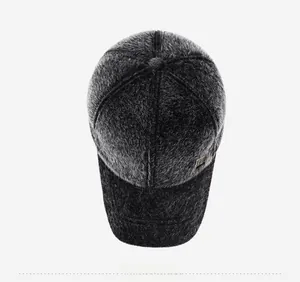 Top down view of a winter baseball cap with thick faux fur and metal logo detail