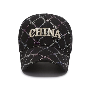 Black baseball cap with 3D CHINA embroidery and all-over colorful heart pattern print
