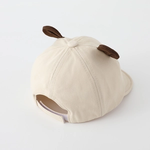 Detail showing soft cotton baby baseball cap with bear ears and adjustable velcro strap