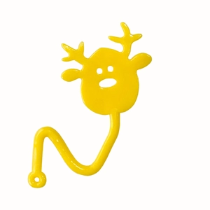 Detail of yellow sticky TPR reindeer toy showing its elastic texture and curved tail