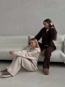 Women's knit lounge set with half-zip pullover and wide-leg pants in cream and brown