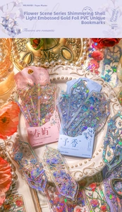Detail of embossed floral PVC bookmark with gold foil and laser shell texture
