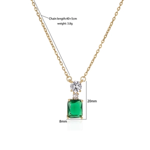 Detailed view of emerald green rectangular pendant with gold chain and size measurements