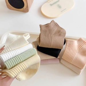 Women's cotton rib-knit ankle socks in multiple candy colors shown on a white tray