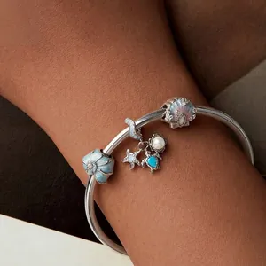 Ocean themed S925 sterling silver charm bracelet with sea turtle, starfish and shell charms