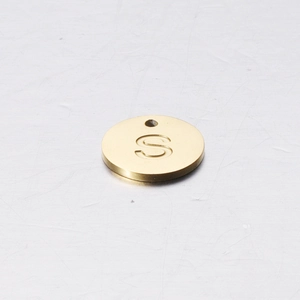 Close-up of a 12mm golden stainless steel round pendant with engraved letter S