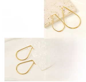 Polished gold teardrop hoop earrings with refined plating shown on aesthetic backgrounds
