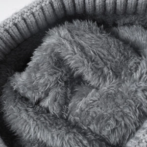 Close-up of winter knit hat featuring a thick grey fleece lining for extra warmth