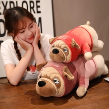 Detailed plush pugs in hoodies on wooden background with soft warm indoor lighting