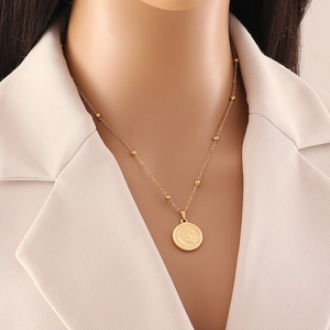 Gold stainless steel double-layered coin necklace with a detailed queen head relief