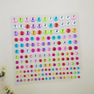 Detailed sheet of colorful adhesive rhinestones for makeup and creative face decoration