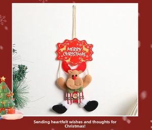 Detail of Christmas reindeer plush ornament with red hanging sign and Merry Christmas text