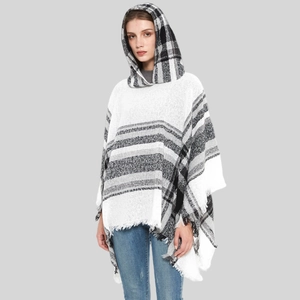 Women's plaid hooded poncho cape with tassel trim in black and white checkered pattern