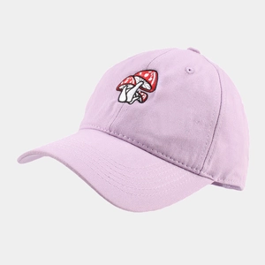 Close-up of three red mushroom embroidery on a light purple cotton baseball cap
