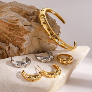 Gold and silver stainless steel jewelry set with star and moon hollow patterns on stone