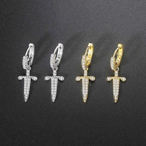 Micro-paved zircon cross hoop earrings available in polished gold and silver finishes