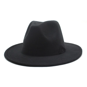 Detail of classic black wool fedora featuring flat brim and matching satin ribbon trim