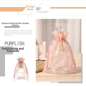 Detailed view of pink organza drawstring pouch featuring white cherry blossom floral prints