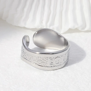 Minimalist silver stainless steel open ring featuring a LOVE engraving and wavy texture