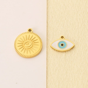 Golden sun charm and blue evil eye pendant set in 18K gold-plated stainless steel