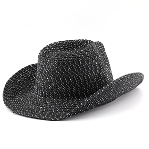 Close-up of black straw cowboy hat featuring woven sparkle texture and wide brim detail