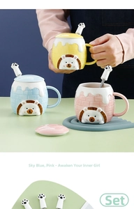 Close-up of ceramic cartoon lion mug with 3D embossed texture and cat claw spoon