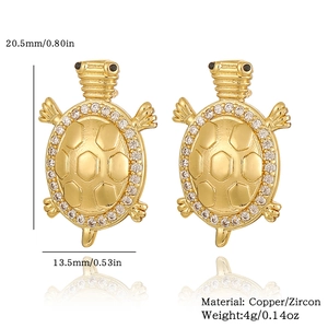 Detailed view of 18K gold turtle earrings with zircons and precise size measurements