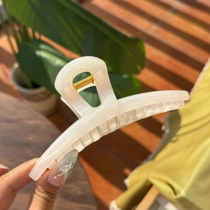 Elegant 13.5cm hollow butterfly hair claw in cream white with a pearlescent finish