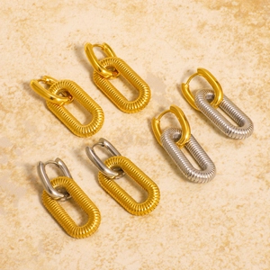 Three pairs of mixed-metal hoop earrings in gold and silver with textured chain design
