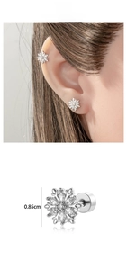 Detailed view of silver snowflake ear stud with zircon inlay and screw back closure