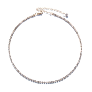 Close-up of gold plated tennis necklace with lobster clasp and adjustable chain tail