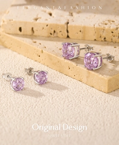 Detailed view of lavender rose-cut stud earrings in a classic four-prong silver setting