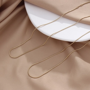 Minimalist double golden thin snake bone chain necklace in stainless steel with silk detail