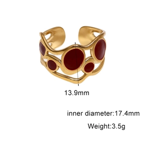 Detail view of 18k gold plated ring with red enamel circles and dimension markings