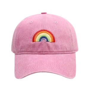 Pink vintage washed cotton baseball cap with colorful rainbow embroidery on front