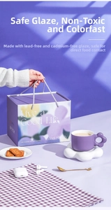 Detail of purple ceramic flower mug with cloud saucer in matching floral gift box