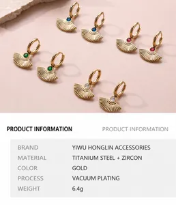 Detailed view of fan-shaped gold titanium steel earrings with colorful zircon inlay set