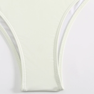 Close-up of high-elastic knit fabric with smooth double-stitched seams and mesh lining