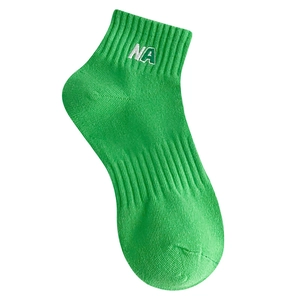 Japanese style green cotton socks with NA letter embroidery and ribbed ankle cuffs