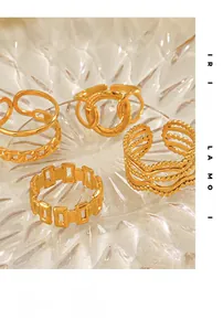 Set of four gold-plated stainless steel rings with minimalist chain and wave patterns