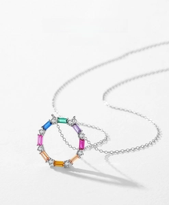 Close-up of S925 silver ring pendant with rainbow baguette cut gemstones and zircons