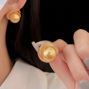 Vintage style gold pearl earrings with sparkling zircon halo for a luxury look