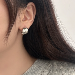 Minimalist silver wide crossover geometric hoop earrings with a high-polished finish