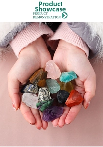 Close-up of hands holding natural raw crystal healing stones like amethyst and rose quartz
