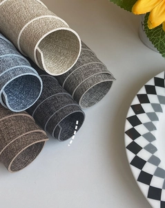 Detail of 1.8mm thick leather placemats showing woven texture and various colors