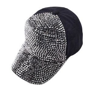 Detailed close-up of shiny silver rhinestones on a black cotton baseball cap