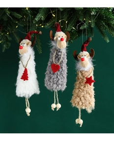 Three plush reindeer ornaments in white, gray and khaki hanging on a Christmas tree
