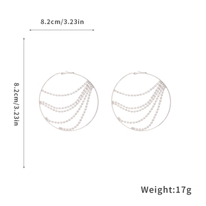 Detailed view of silver tassel hoop earrings with 8.2cm diameter and 17g weight