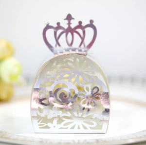 Detailed laser-cut silver candy box with crown top and intricate floral patterns